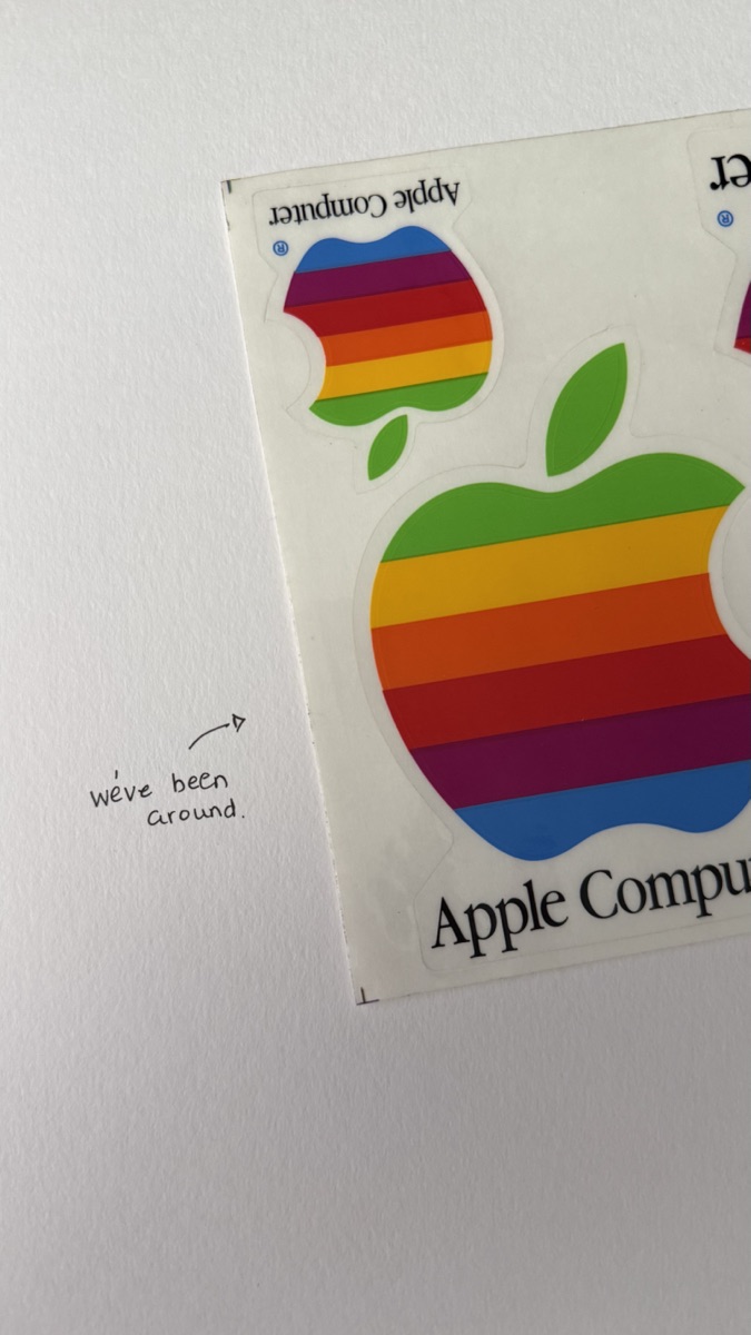 Vintage Apple Computer rainbow logo sticker sheet, with the handwritten note: we’ve been around