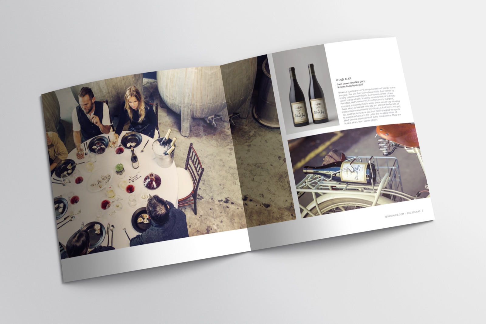 Terroir Life catalog spread: a dinner among concrete fermentation tanks, Wind Gap wine bottles, and a bottle on a bicycle rack